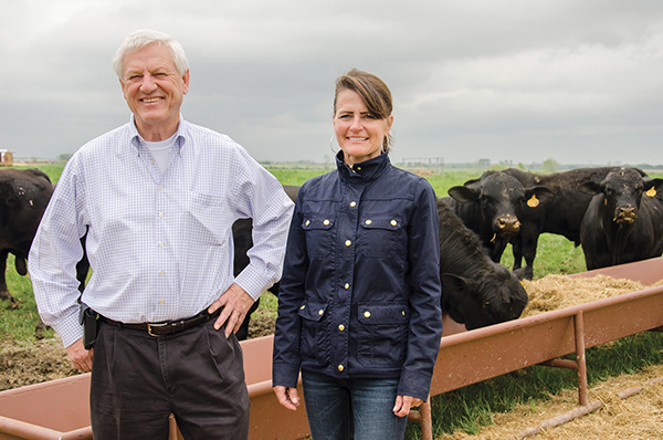 Owner and founder of Town Creek Farm, Milton Sundbeck, is shown with ranch president, Joy Reznicek, among his powerfully bred Brangus bulls.
